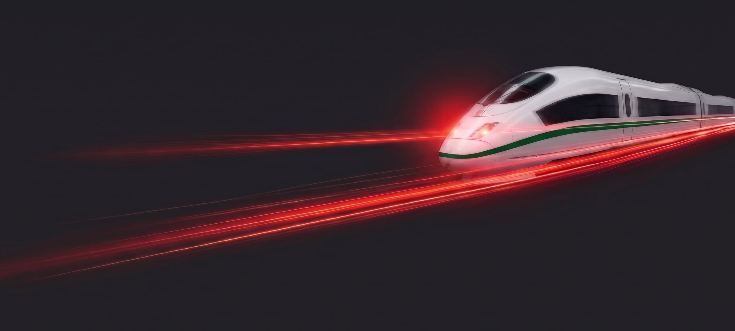Hochgeschwindigkeitszug in Fahrt, dessen Scheinwerfer rote Lichtspuren nach vorne werfen